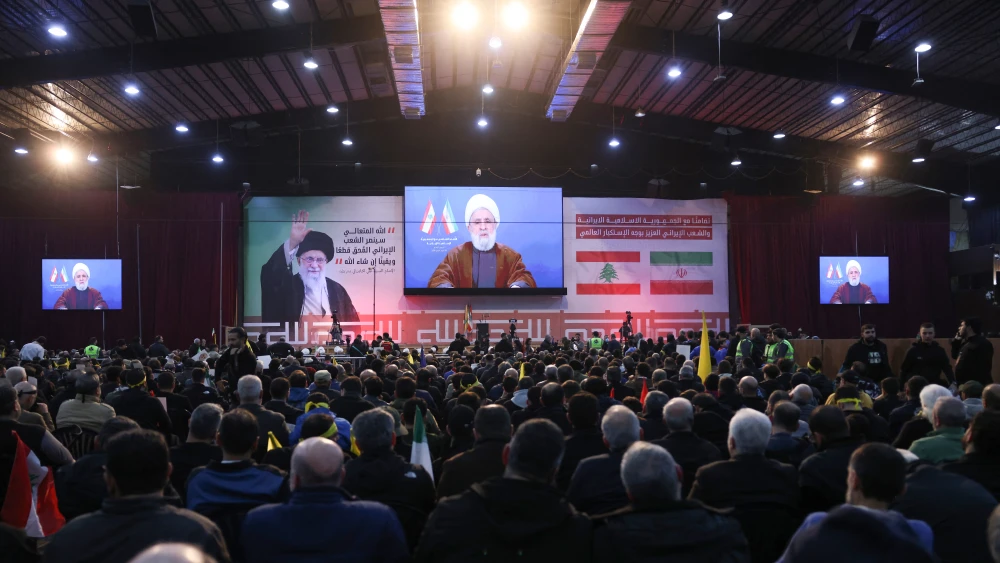 Supporters watch a televised speech by Hezbollah chief Naim Qassem during a rally to show their solidarity with Iran, in the southern suburb of Beirut on January 26, 2026. Photo by Anwar Amro/AFP via Getty Images.