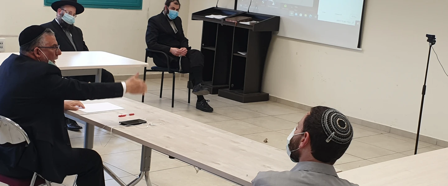 In light of the coronavirus, members of the Israeli Ministry of Affairs discuss the holiday of Lag B'Omer, and the traditional celebration and bonfires in Meron, in May 2020. Credit: Israeli Ministry of Affairs.