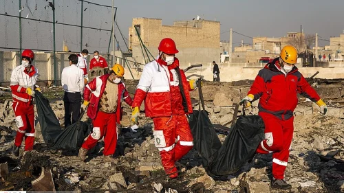 Bodies are removed from the crash site of a Ukrainian Boeing 737 passenger jet near Imam Khomeini Airport in Tehran on Jan. 8, 2020. Credit: Sadegh Nikgostar/Fars News via Wikimedia Commons.