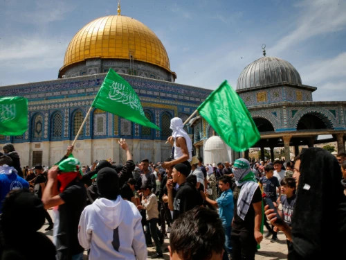 Muslims wave Hamas flags after Friday prayers during Ramadan, on the Temple Mount in Jerusalem, April 22, 2022. Photo by Jamal Awad/Flash90.