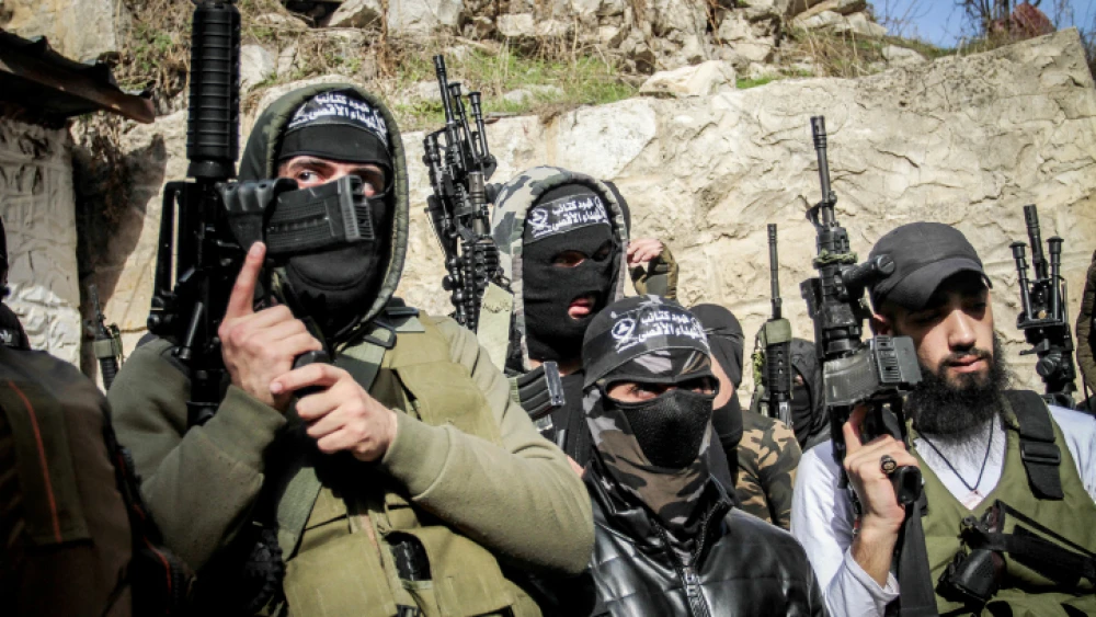 Masked Palestinians hold their guns during the funeral of Palestinian Jamil al-Kayyal, who was killed in clashes with Israeli forces in Nablus, Dec. 13, 2021. Photo by Nasser Ishtayeh/Flash90.