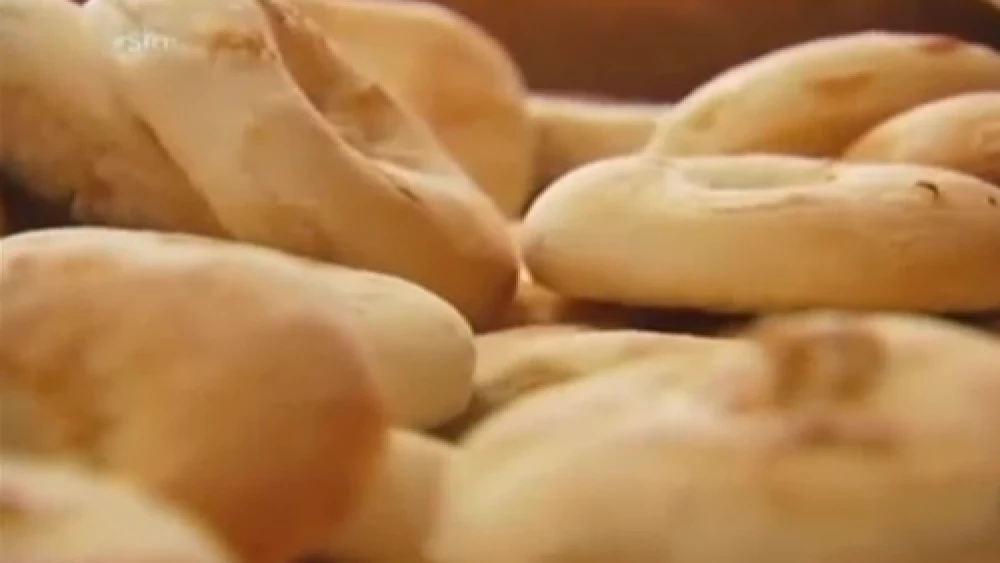 Click photo to download. Caption: Bialys from Kossar's, formerly owned by Juda Engelmayer and his wife. Credit: YouTube.