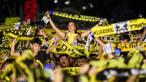 At Sacher Park in Jerusalem, Beitar Jerusalem fans celebrate their team winning the State Cup Final on May 24, 2023. Photo by Noam Revkin Fenton/Flash90.