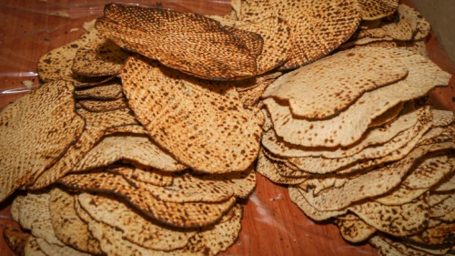 Matzah being prepared at Beit Midrash “Beor Panich” in Gush Etzion, Israel, on April 2, 2017. Photo by Gershon Elinson/Flash90.