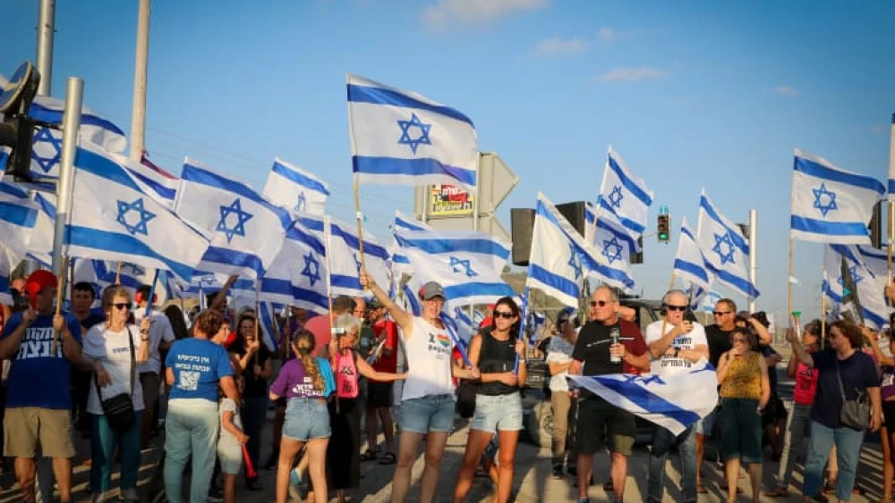 A protest against the Israeli government's judicial overhaul at Nahalal Junction, northern Israel, on Aug. 26, 2023. Photo by Anat Hermony/Flash90.