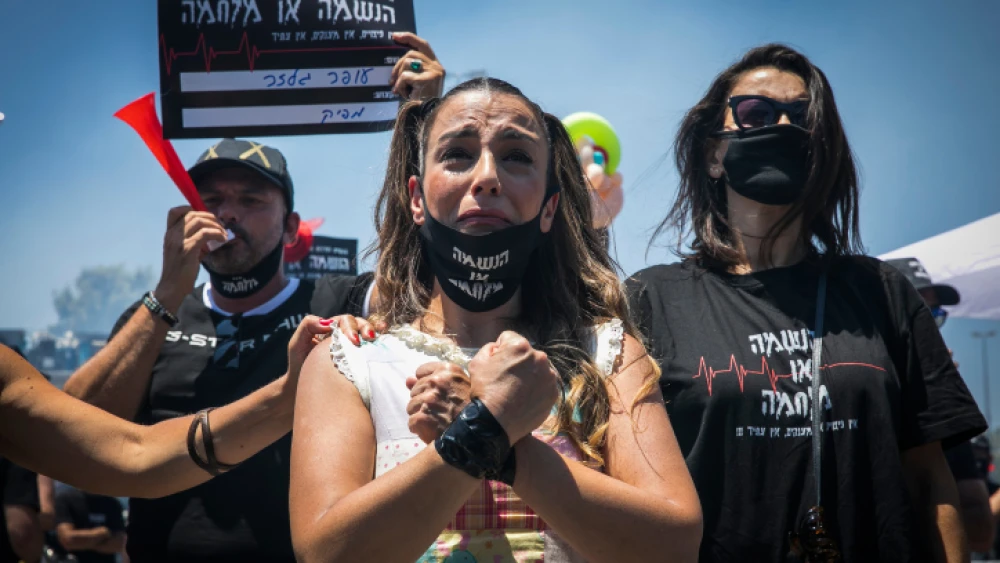 Israeli workers from the culture and art section protest outside the Ministry of Finance in Jerusalem, calling for financial support from the Israeli government, on June 29, 2020. Photo by Olivier Fitoussi/Flash90.