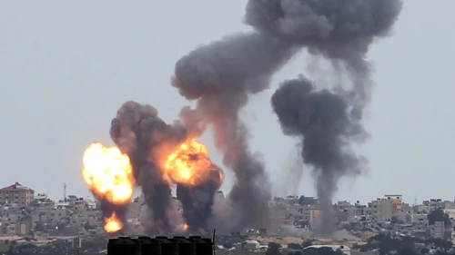 A ball of fire and smoke rises above buildings during Israeli airstrikes in the southern Gaza Strip after a slew of 14 rockets were launched towards southern Israel, on Feb. 24, 2020. Photo by Abed Rahim Khatib/Flash90.