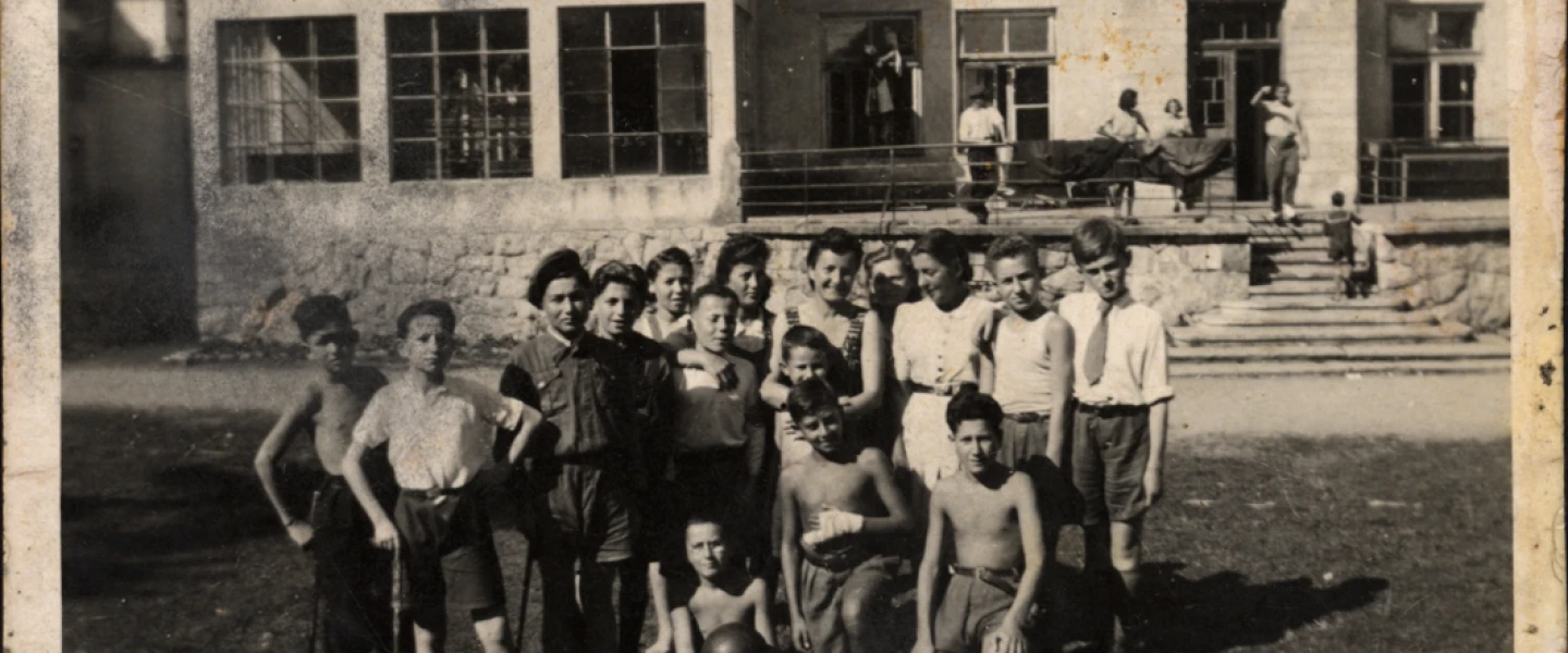 Lena Küchler (center), director of the children's home in Zakopane, Poland, with the children and staff in 1945. Credit: Yad Vashem.