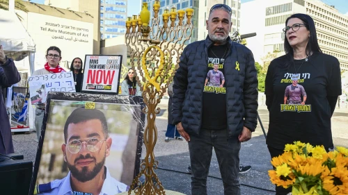 Relatives, friends and supporters of Master Sgt. Ran Gvili, whose body is held by Hamas, attend a Kabbalat Shabbat ceremony and the lighting of Hanukkah candles at Hostage Square in Tel Aviv, calling for the return of his body from Hamas captivity, on Dec. 19, 2025. Photo by Avshalom Sassoni/Flash90.