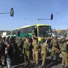 Israeli security personnel at the scene of a terrorist attack on a bus near Neve Daniel in Gush Etzion, south of Jerusalem, March 31, 2022. Photo by Israel Kasnett.
