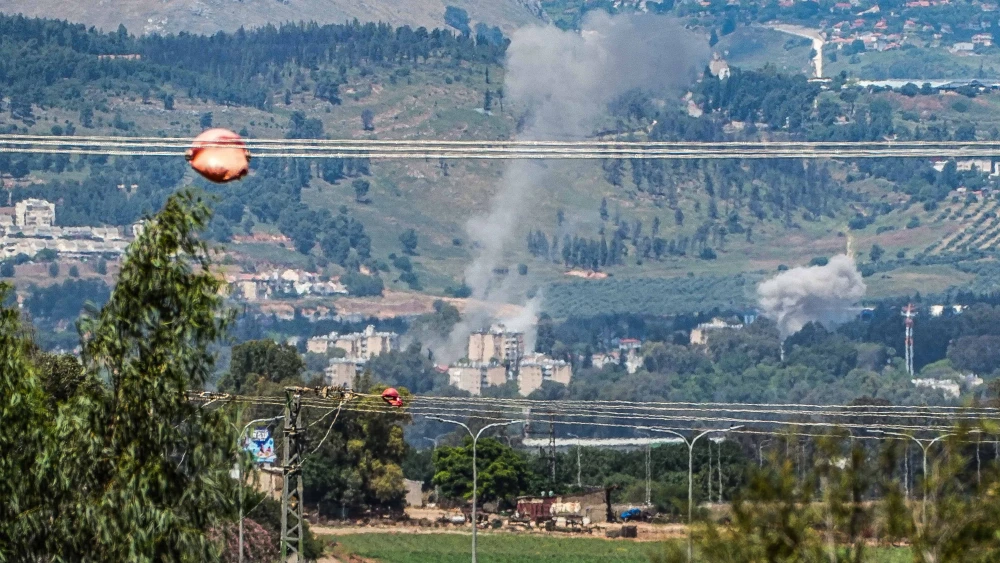 Smoke rises after rockets fired from Lebanon hit the northern Israeli city of Kiryat Shmona, May 5, 2024. Photo by Ayal Margolin/Flash90.