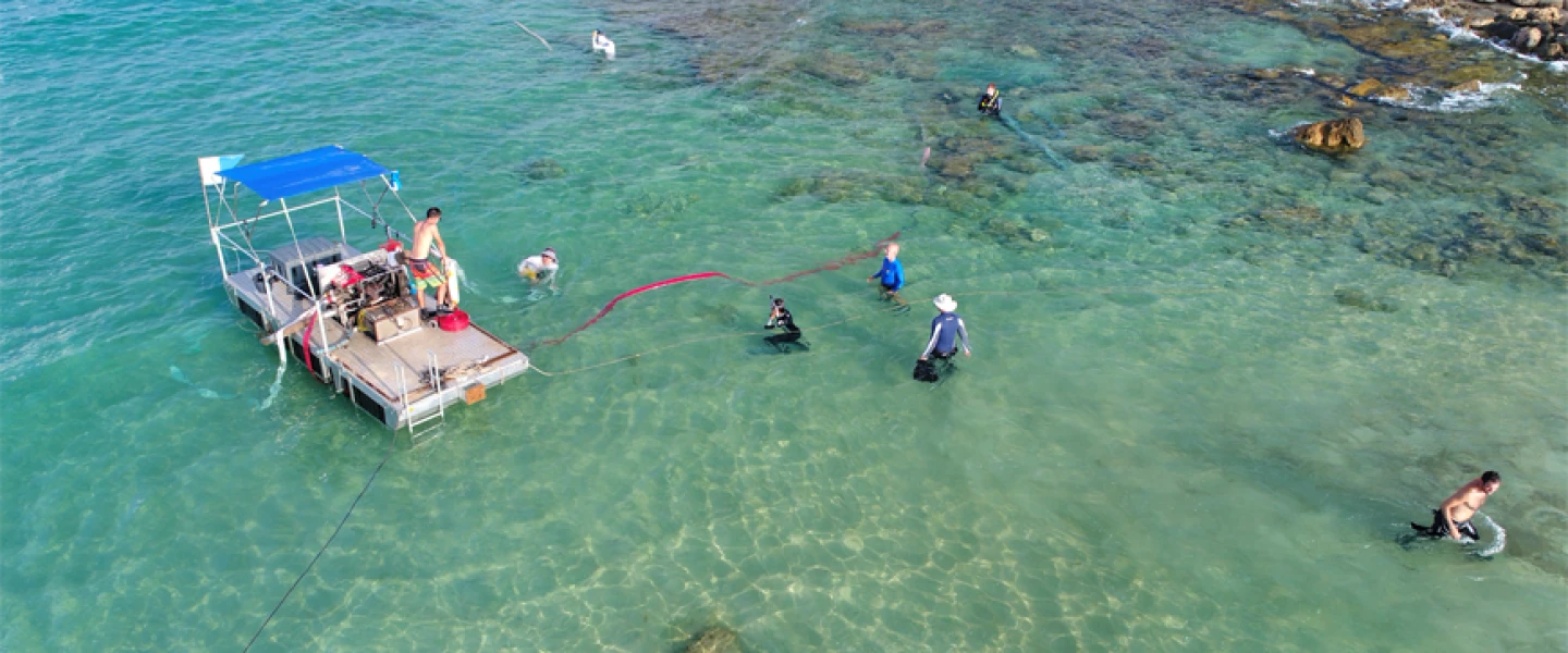 Near-shore excavation with newly developed barge system at biblical port of Tel Dor, Israel, by researchers at the University of Haifa and the University of Californian San Diego’s Scripps Center for Marine Archaeology (SCMA). Photo by Anthony Tamberino/SCMA.