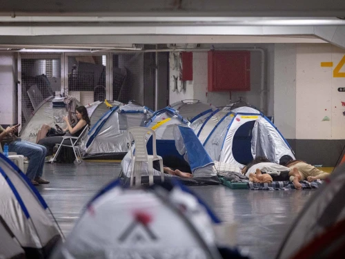 People take shelter in an underground parking lot in Tel Aviv during the war between Israel and Iran, June 24, 2025. Photo by Chaim Goldberg/Flash90.