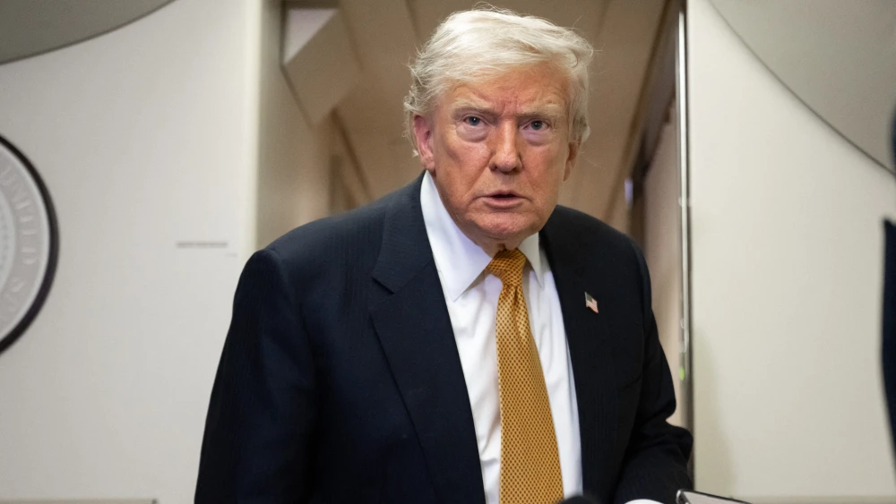 U.S. President Donald Trump speaks with the media aboard Air Force One shortly after departure from Mildenhall Air Force Base in the United Kingdom, en route to Washington, on July 8, 2026. Photo by Saul Loeb/AFP via Getty Images.