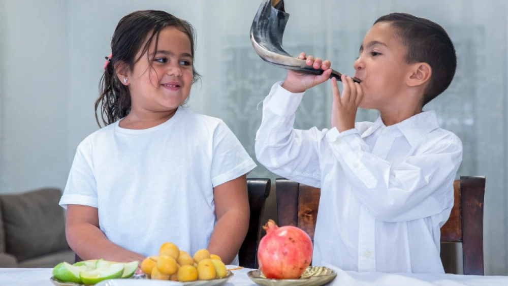 Kids prepare for the Jewish New Year at their home in Moshav Yashresh, Sept. 11, 2020. Photo by Yossi Aloni/Flash90.