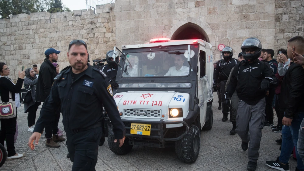 Israeli medics evacuate an injured terrorist near the scene of an attempted stabbing attack outside Jerusalem's Old City on Oct. 28, 2019. Photo by Yonatan Sindel/Flash90.