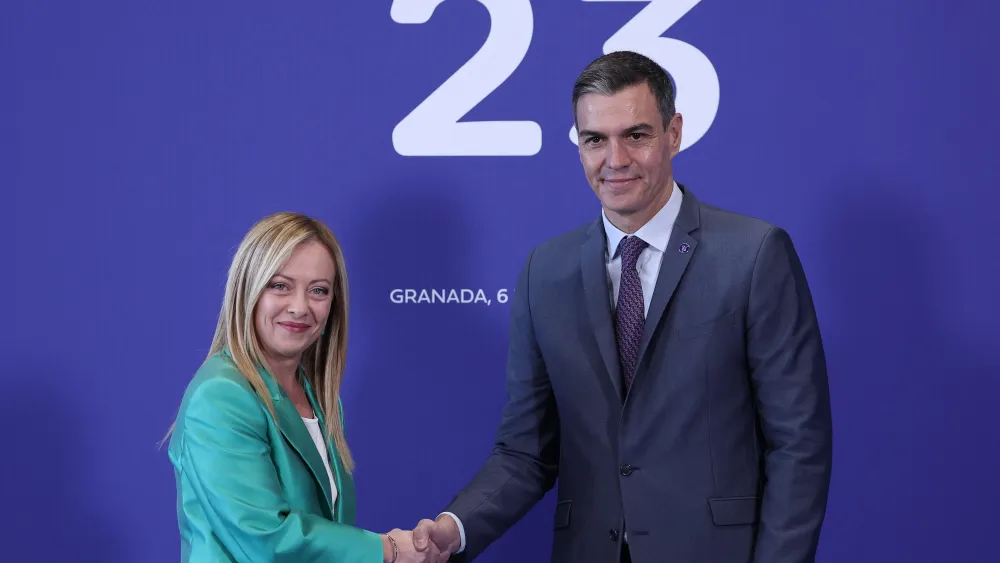Spain's Prime Minister Pedro Sanchez welcomes Italian Prime Minister Giorgia Meloni as she arrives for the second day of the European Political Community summit at the Palacio de Congreso in Granada, southern Spain, on Oct. 6, 2023. Photo by Thomas Coex/AFP via Getty Images.