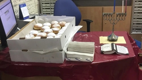 Click photo to download. Caption: Eliana Rudee's Hanukkah miracle story—sufganiyot) jelly donuts at the bank in Israel. Credit: Eliana Rudee.