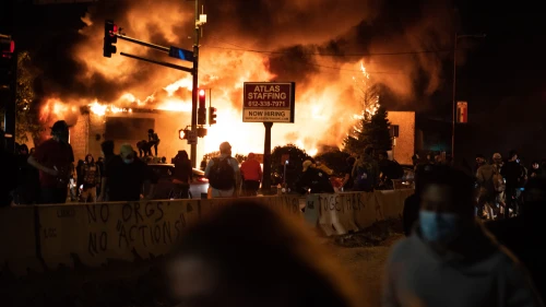 Buildings burn during riots in Minneapolis four days after the death of African-American George Floyd, May 29, 2020. Credit: Hungryogrephotos via Wikimedia Commons.