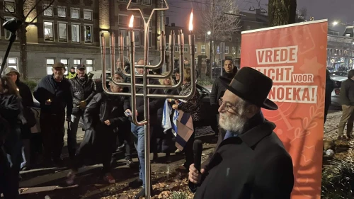 Dutch Chief Rabbi Binyomyn Jacobs speaks at a rally outside the Royal Concert Hall in Amsterdam, the Netherlands on Dec. 14, 2025. Photo courtesy of Ronny Naftaniel.