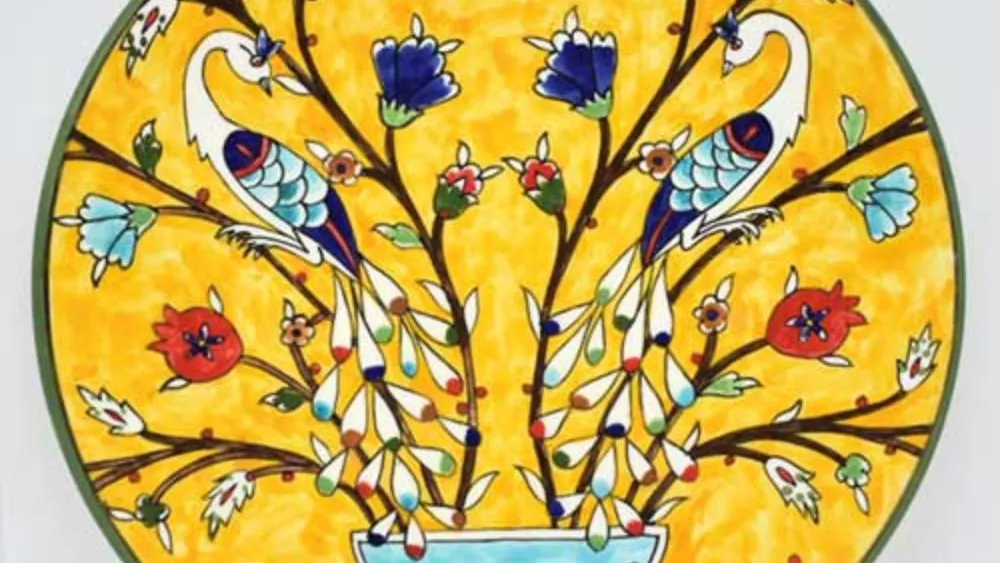 A plate decorated with Hagop Karakashian’s peacock design. Photo courtesy of Hagop and Tzoghig Karakashian.