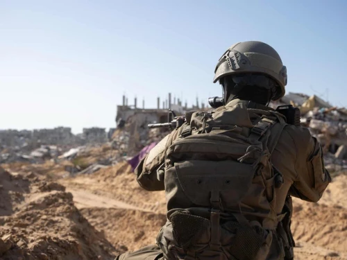 IDF soldier seen in an unknown location in the Gaza Strip, in front of rubble and ruin. Credit: IDF.