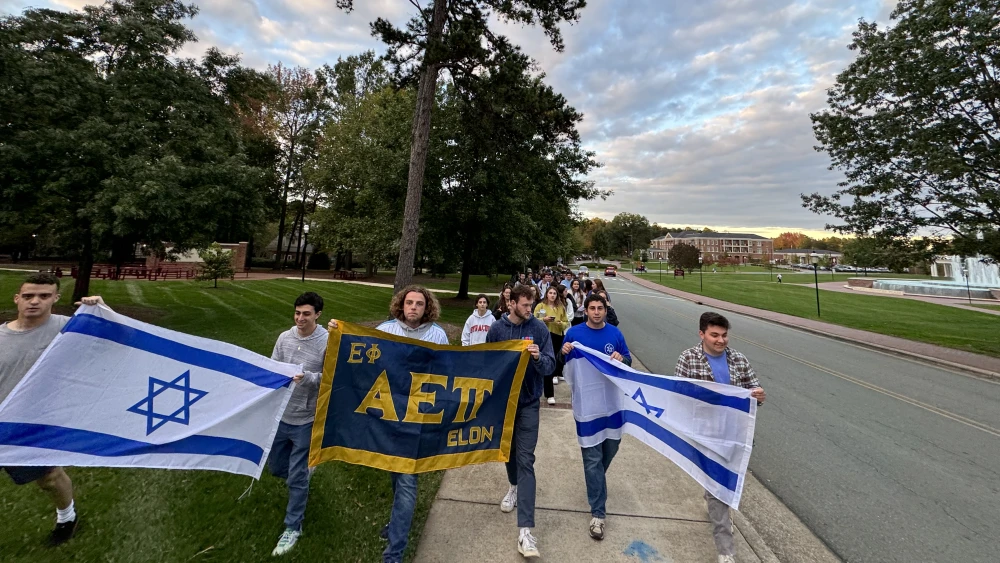 AEPi brothers at Elon University lead a silent march on campus to educate the community about the Holocaust and modern antisemitism. Credit: Courtesy of AEPi 