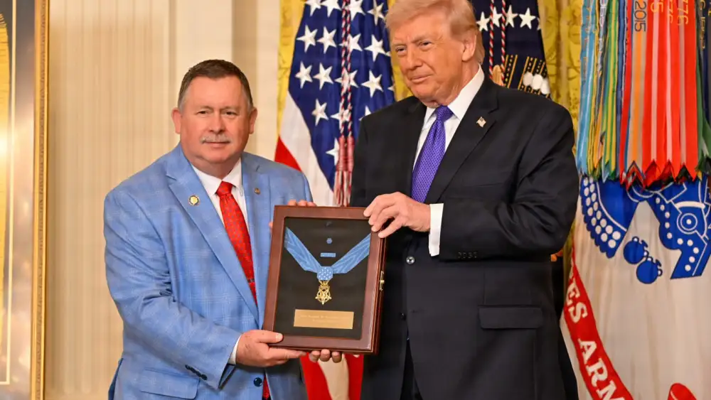 U.S. President Donald Trump presents the Medal of Honor to Chris Edmonds, son of U.S. Army Master Sgt. Roddie Edmonds, during a Medal of Honor ceremony at the White House in Washington, D.C., on March 2, 2026. Credit: Christopher Kaufmann/U.S. Army.