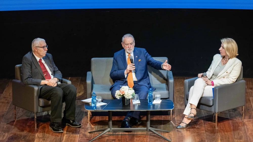 U.S. Ambassador Mike Huckabee in conversation with NGO Monitor’s president, Prof. Gerald Steinberg, and vice president Olga Deutsch at the Menachem Begin Heritage Center in Jerusalem, Dec. 10, 2025. Photo by Matt Kaminsky/JNS.