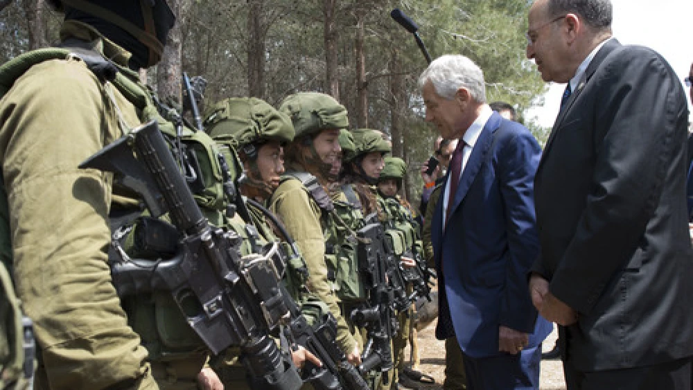 U.S. Secretary of Defense Chuck Hagel and Israeli Minister of Defense Moshe Ya'alon (right) speak with members of the K-9 Special Forces Unit at Camp Adam in Israel on April 23, 2013. Credit: Secretary of Defense.