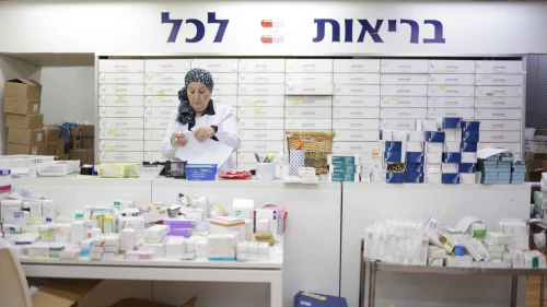 Yad Sarah Pharmacist Sorting Medication for Distribution. Credit: Daniel Jankovic