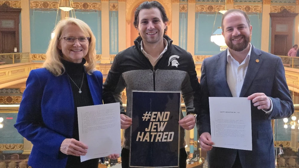 Republican state senator Lana Theis stands in the Michigan Senate gallery with Adar Rubin, director of mobilization for End Jew Hatred, and Democratic state senator Jeremy Moss following the Senate passage of Theis' End Jew-Hatred resolution, April 29, 2026. Credit: Office of Sen. Lana Theis.