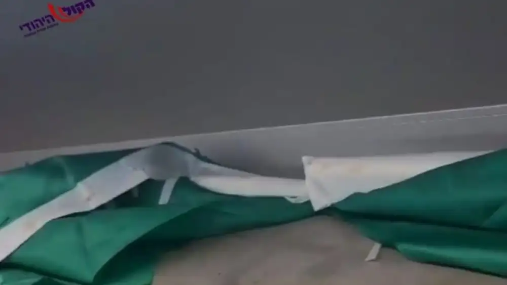 Hamas flag found in a storage compartment of an Arab driver transporting IDF soldiers. Credit: Courtesy of HaKol HaYehudi.