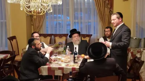 Rabbi Menachem Bombach (standing) explained his school’s network to fellow members of the haredi community. Credit: Courtesy.