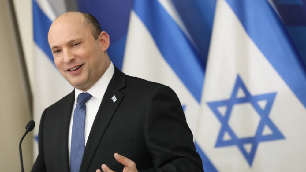 Israeli Prime Minister Naftali Bennett holds a press conference about the COVID-19, at HaKirya base in Tel Aviv, Jan. 11, 2022. Photo by Noam Revkin Fenton/Flash90.