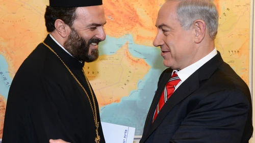 Click photo to download. Caption: Israel's Prime Minister Benjamin Netanyahu (right) meets with Greek Orthodox priest Father Gabriel Nadaf in Jerusalem, on August 5, 2013. Nadaf is a vocal supporter of Christian recruitment into the Israel Defense Forces. Credit: Moshe Milner/GPO/FLASH90.