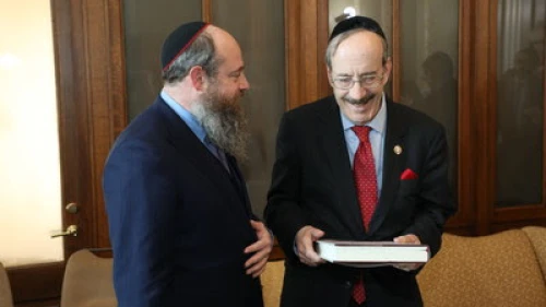 Rabbi Menachem Even-Israel, the son of Rabbi Adin Even-Israel Steinsaltz, presents the first volume of the Steinsaltz Talmud to Rep. Eliot Engel (D-N.Y.). Credit: The Aleph Society.