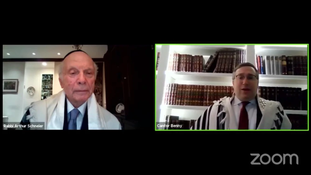 Cantor Benny Rogosnitzky of the Park East Synagogue during a pre-Shabbat services as Rabbi Arthur Schneier watches from his home. Source: Screenshot.