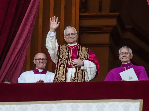 Pope Leo XIV greets the crowd from St. Peter's Basilica in Vatican City after being elected by the Conclave of Cardinals on May 8, 2025. Photo by Ivan Romano/Getty Images.