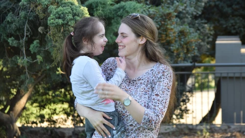 An ALEH volunteer spends time with a child with disabilities. Credit: ALEH: Advancement and Rehabilitation of Children with Complex Disabilities.