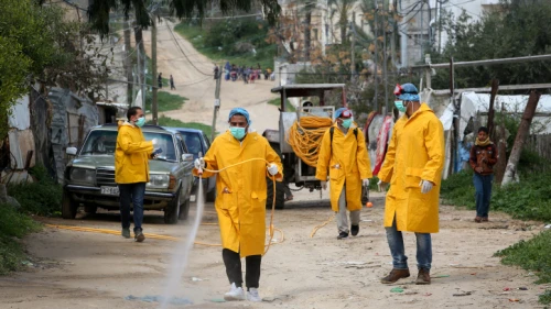 Palestinian health workers spray disinfectant as a precaution against the spread of the COVID-19 virus, in Rafah, southern Gaza Strip, on March 22, 2020. Photo by Abed Rahim Khatib/ Flash90.