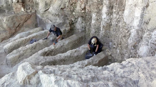 Researchers examine the mysterious channels unearthed in the City of David National Park in Jerusalem. Photo by Emil Aladjem/Israel Antiquities Authority.