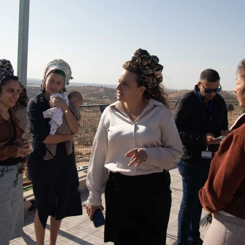 Tzofia Lichtenstein with other women from the new settlement of Mitzpe Ziv in the Hebron Hills speaks to journalists, Nov. 27, 2025. Photo by David Isaac.