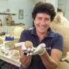 Archeologist Alla Nagorsky holding the ancient egg, June 2021. Credit: Israel Antiquities Authority.