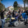 Disabled veteran Israel Defense Forces soldiers and their assistants protest outside the Defense Ministry in Tel Aviv, on March 29, 2016. Photo by Yossi Zamir/Flash90.