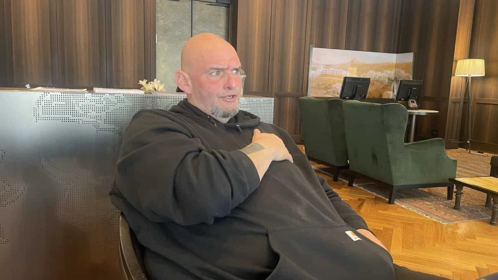 Sen. John Fetterman (D-Pa.) talks to reporters in Jerusalem on March 19, 2025. Credit: Alex Traiman