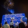 Israelis watch fireworks during a show to mark Israel's 73rd Independence Day, in Rabin Square in Tel Aviv on April 14, 2021. Photo by Miriam Alster/Flash90.