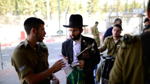 Men arrive at the IDF's Tel Hashomer induction center to join the Netzah Yehuda infantry battalion, July 30, 2015. Photo by Tomer Neuberg/Flash90.