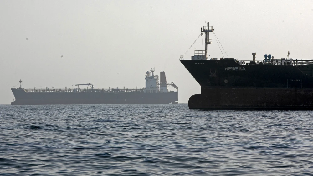 A ship remains anchored on May 16, 2026 in the Strait of Hormuz near Larak Island, Iran. Photo by Majid Saeedi/Getty Images.