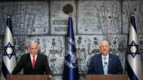 Israeli President Reuven Rivlin presents Prime Minister Benjamin Netanyahu with the mandate to form a new government after the results of the country's general election were announced, at the President's Residence in Jerusalem on Sept. 25, 2019. Photo by Yonatan Sindel/Flash90.
